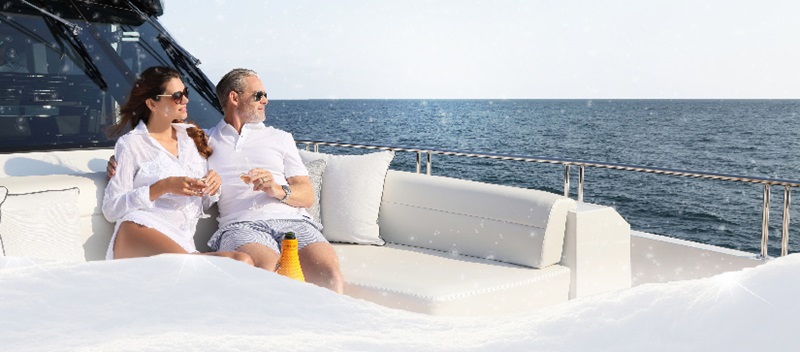 Two people lounging on a yacht